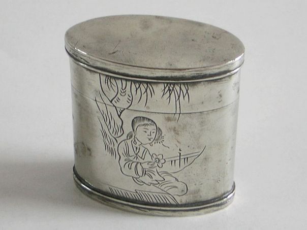 Oval opium box decorated with a girl holding a flower – (0917)
